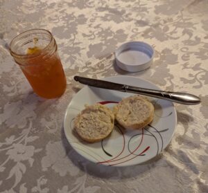 Jar of apricot jam with biscuits